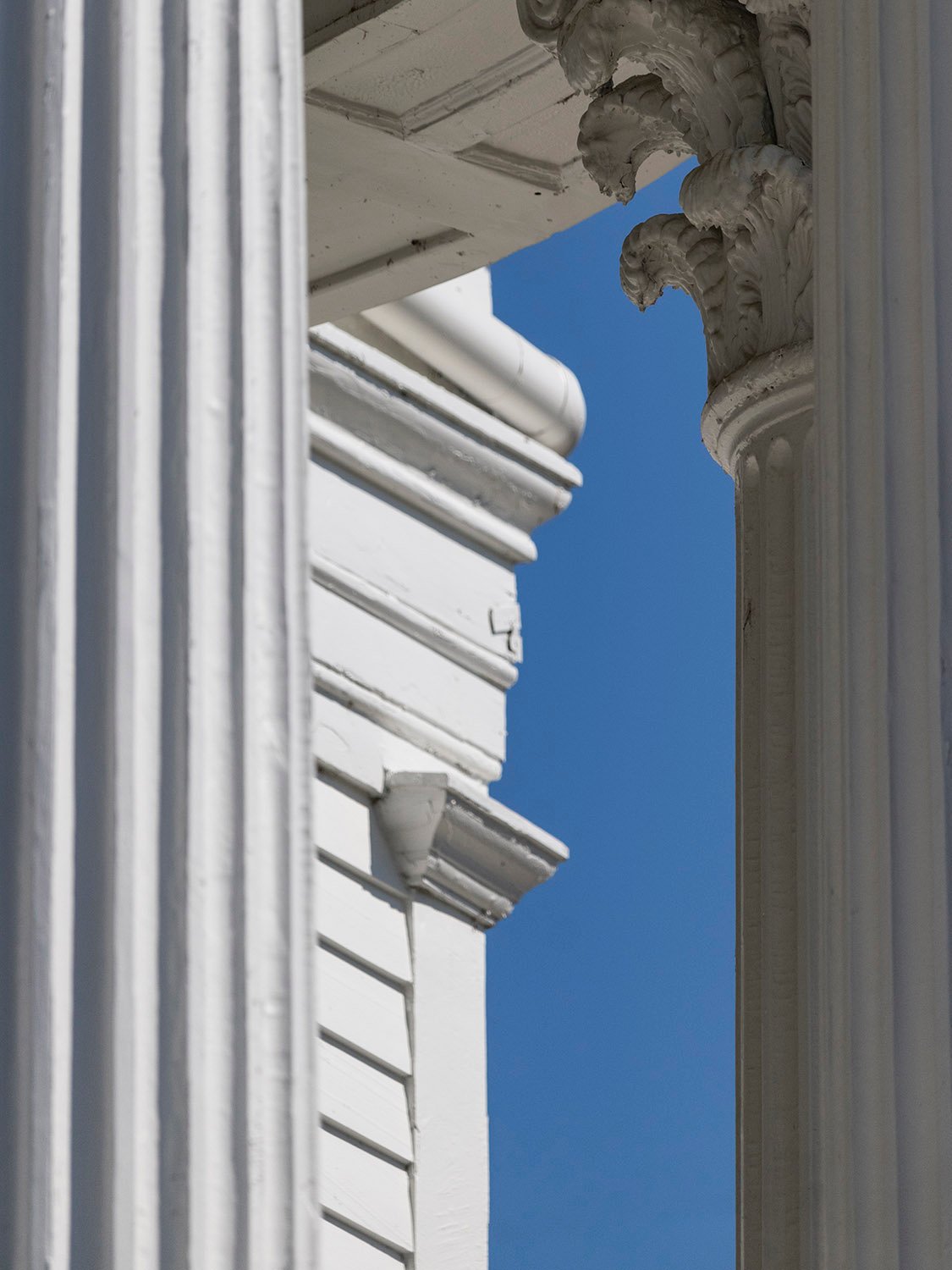 Looking between columns at a pilaster on the John Blackmar Residence, Columbus, Georgia