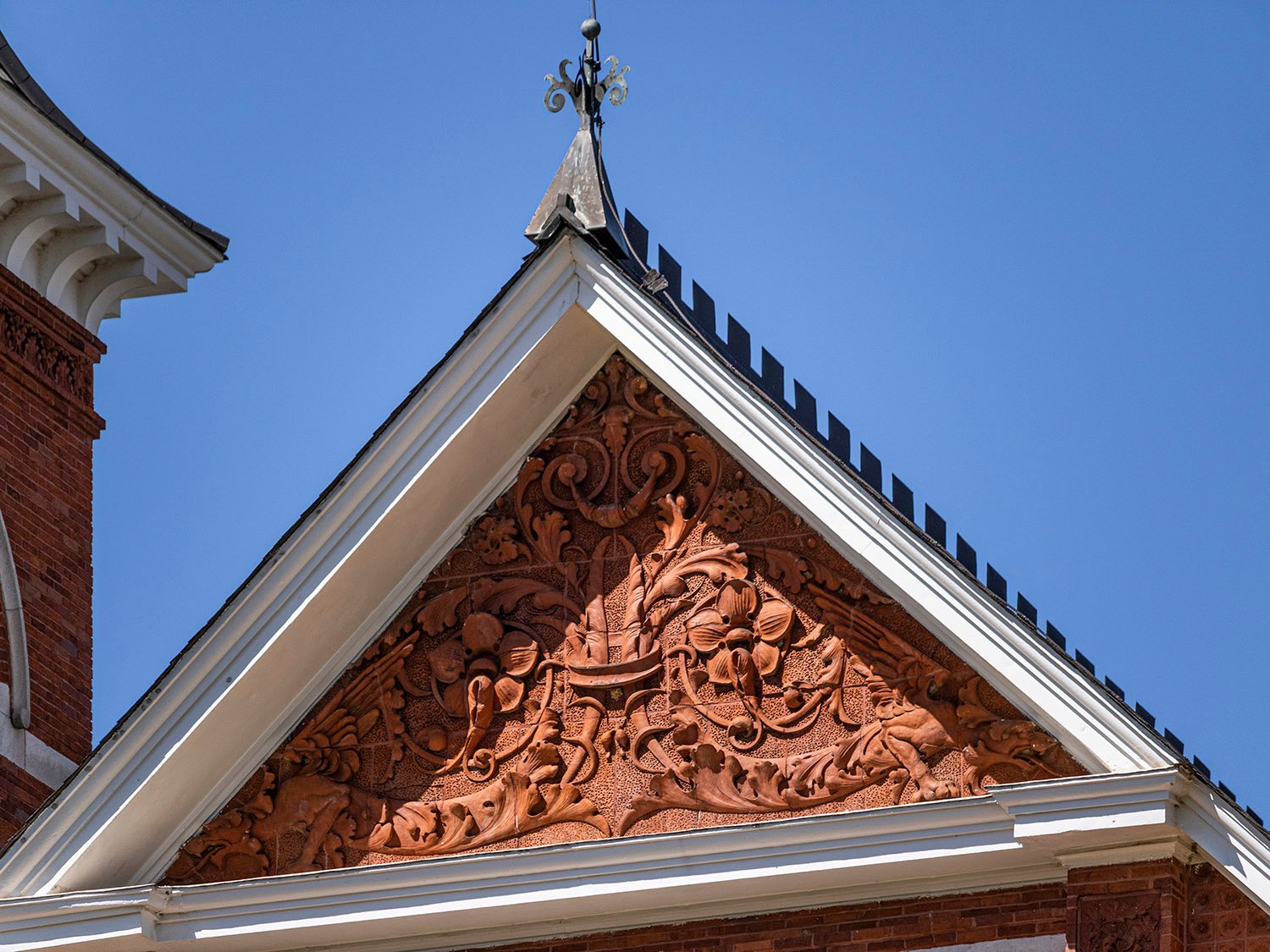 Terracotta tympanum and roof finial on the facade of Samford Hall, Auburn, Alabama