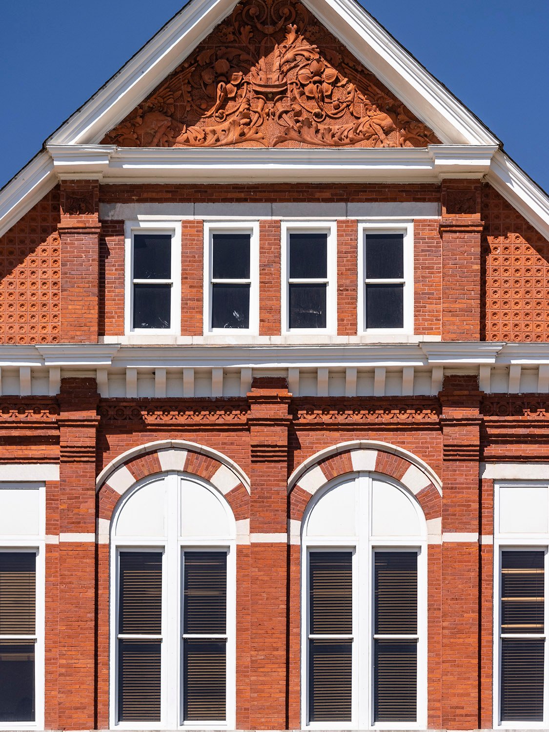 Third-floor windows and the gable on the center bay of Samford Hall, Auburn, Alabama