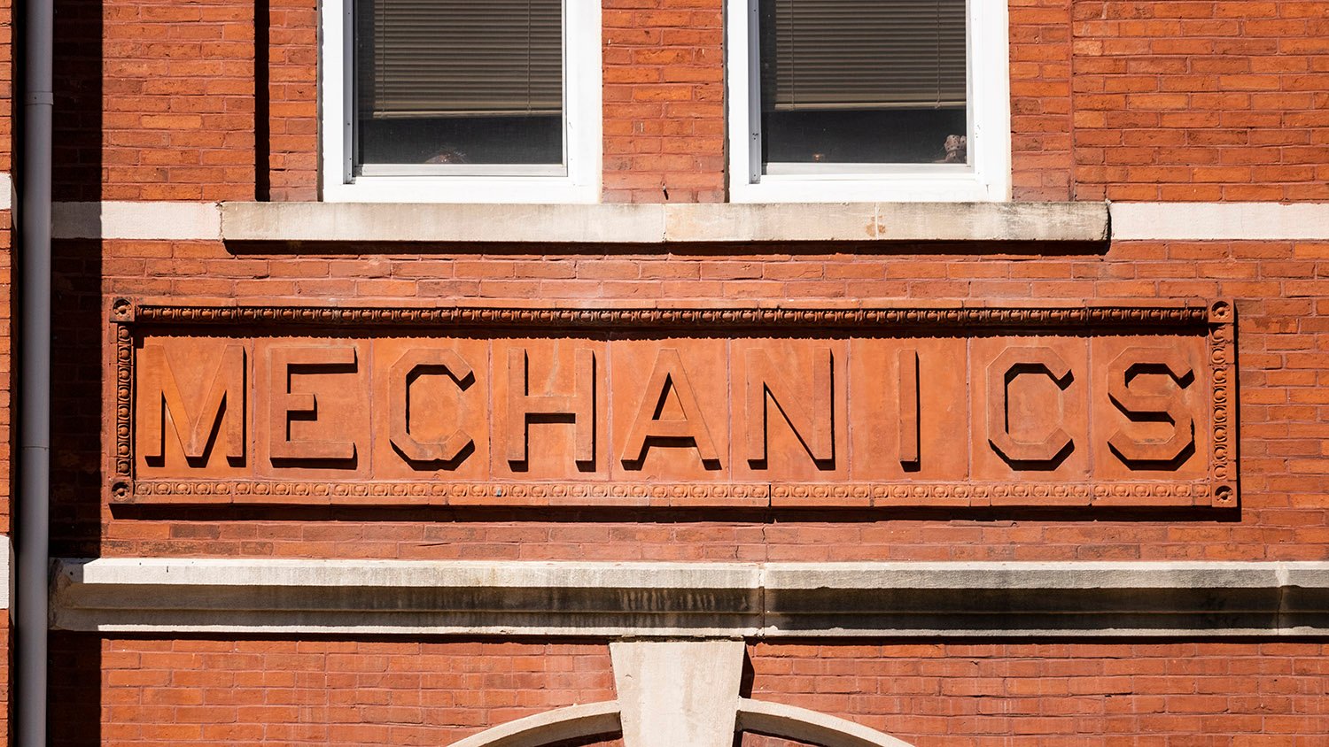 Terracotta inscription over the northeast entrance of Samford Hall, Auburn, Alabama