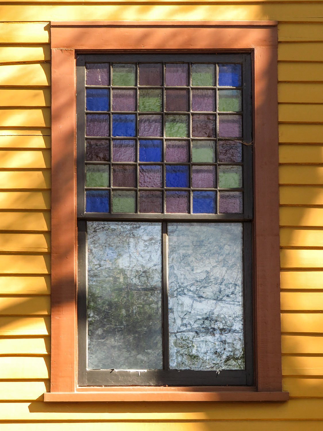 Stained-glass window on the west elevation of The Wren's Nest
