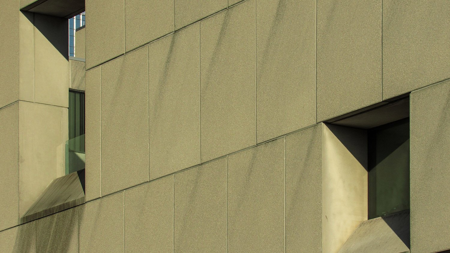 Looking at the upper windows on the facade of the Atlanta Central Library