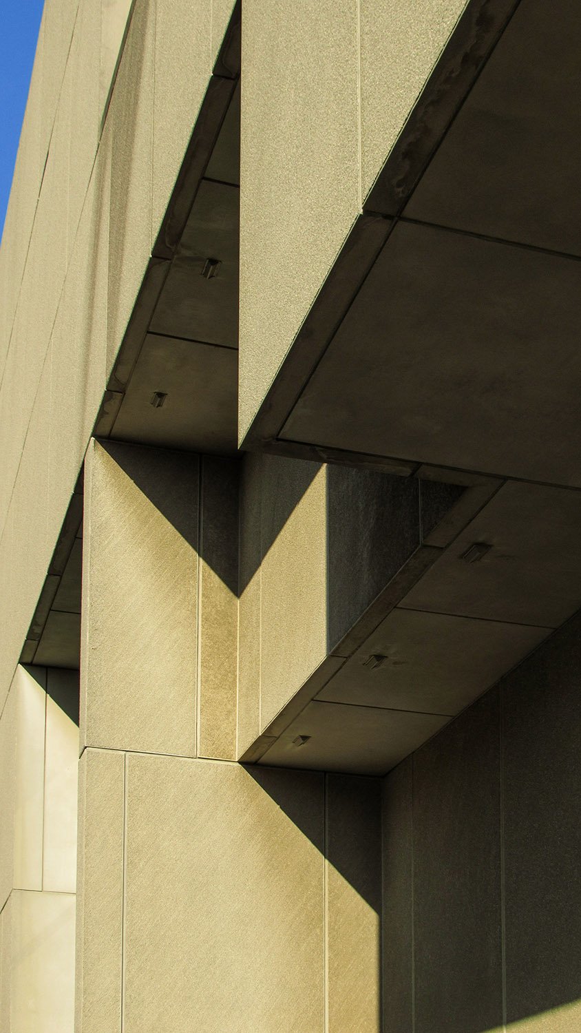 Looking up at cantilevered floors on the facade of the Atlanta Central Library