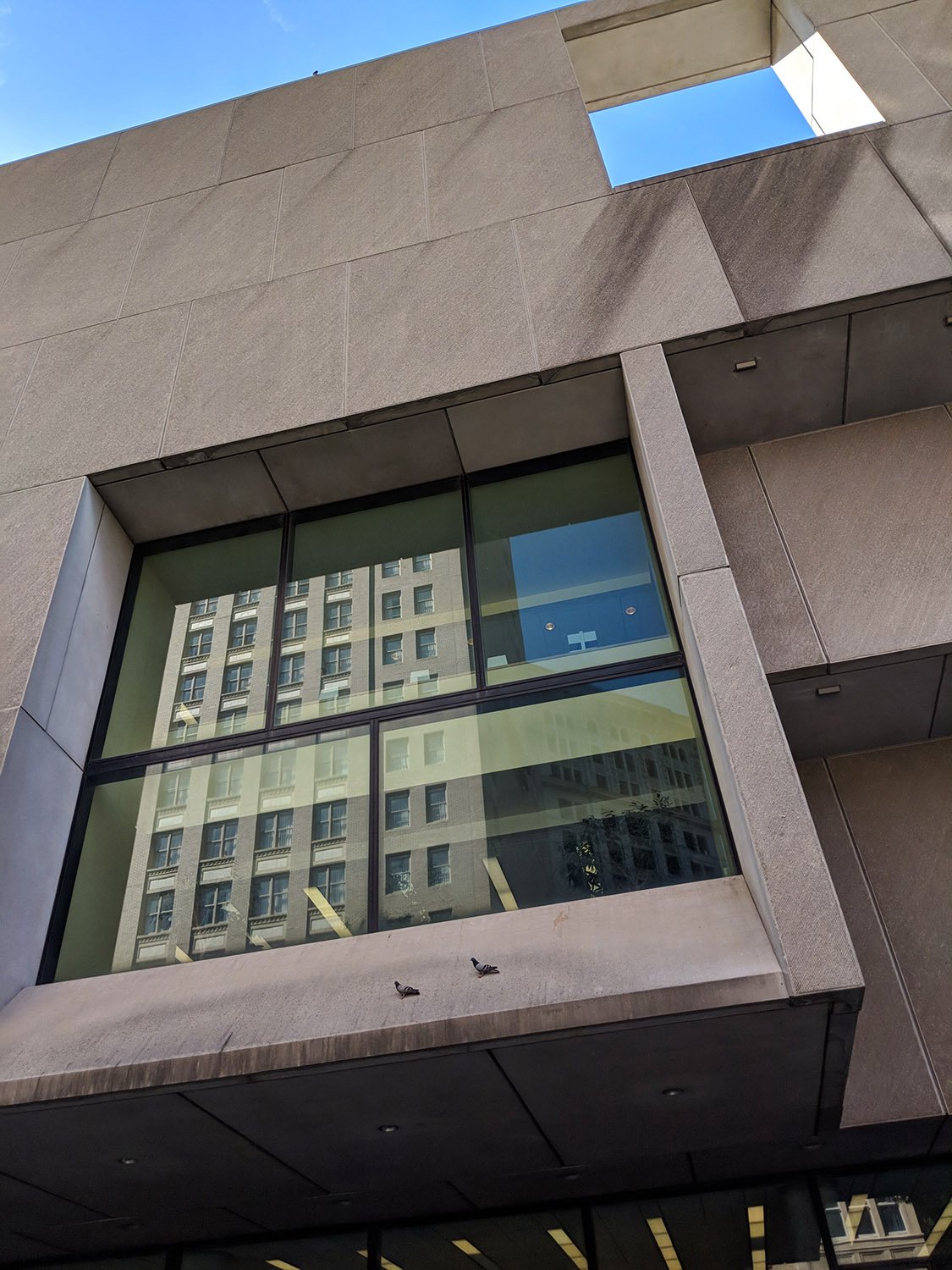 Looking up at the two-story window on the facade of Atlanta Central Library before renovation