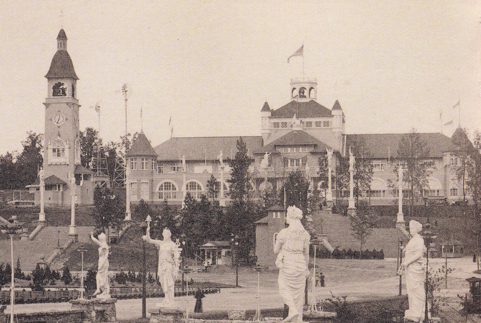 View of Cotton States and International Exposition with New York Herald Building under construction (visible between 2nd and 3rd statues).