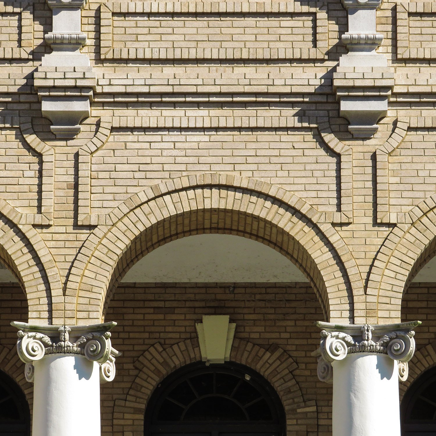 Arch and capitals on the front portico of the Sumter County Courthouse, Bushnell, Florida