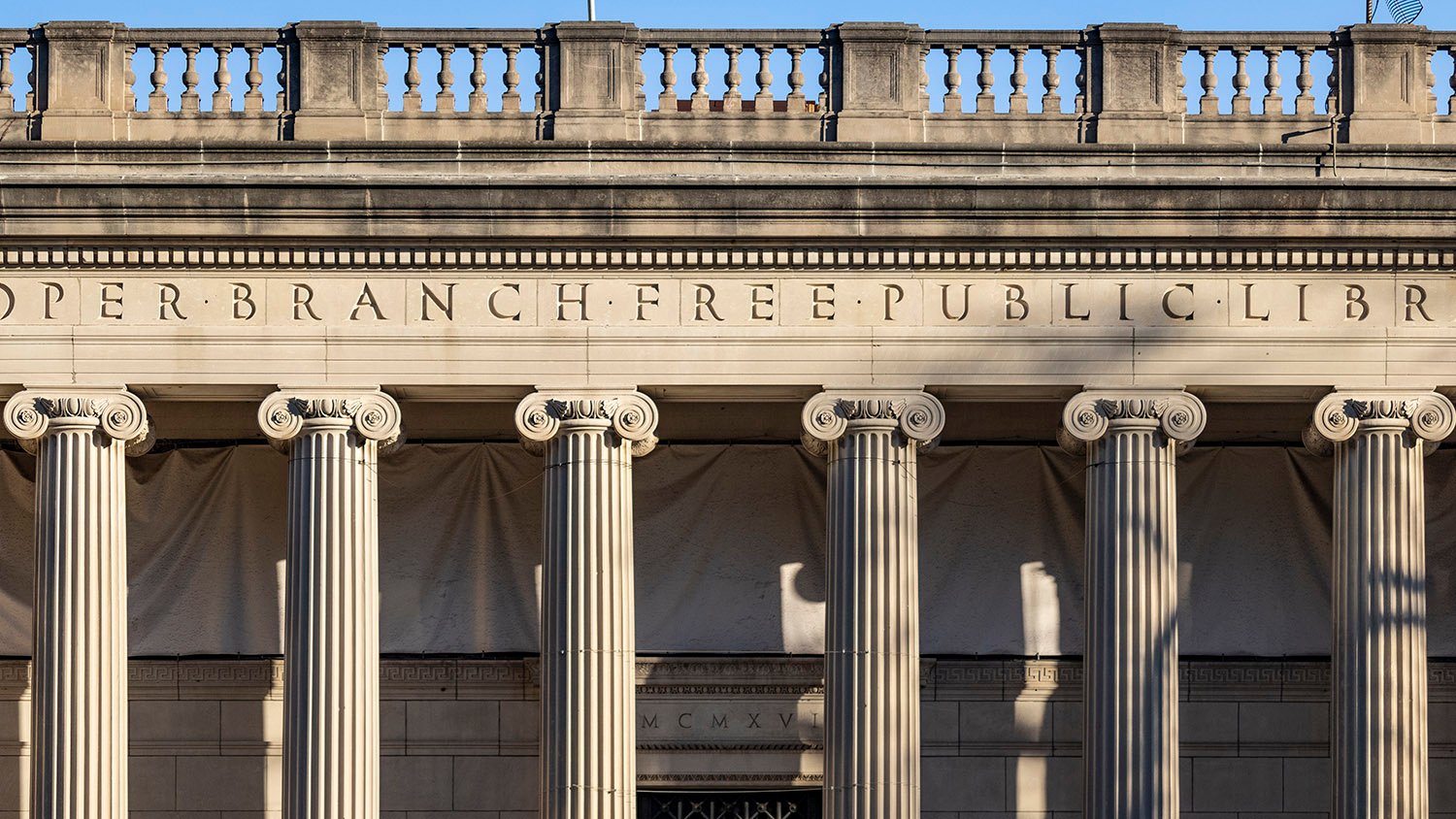 Balustrade, inscription, and columns on the facade of the Cooper Branch Free Public Library, Camden, New Jersey
