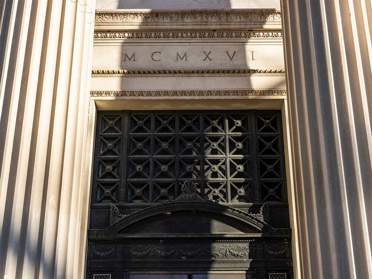 Date inscription, ornamental iron, and pediment above the main entrance of the Cooper Branch Free Public Library, Camden, New Jersey