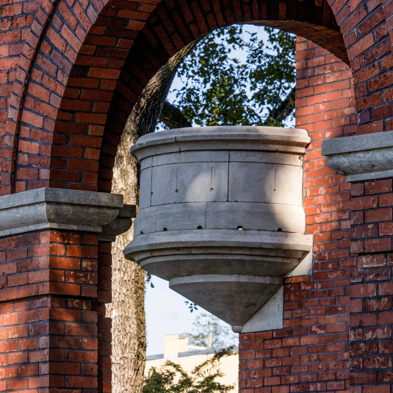 Looking through the front porch of the Gwinnett County Courthouse toward the corner balcony on the tower  