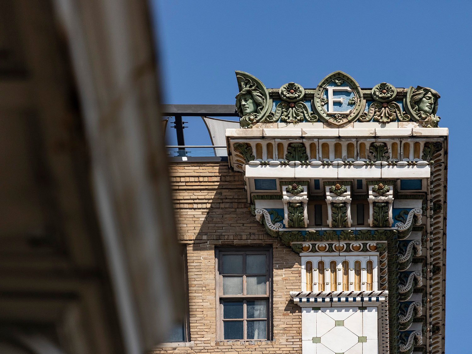 Crest, cornice, eaves, and pilaster capital on the Empire Building, Birmingham, Alabama