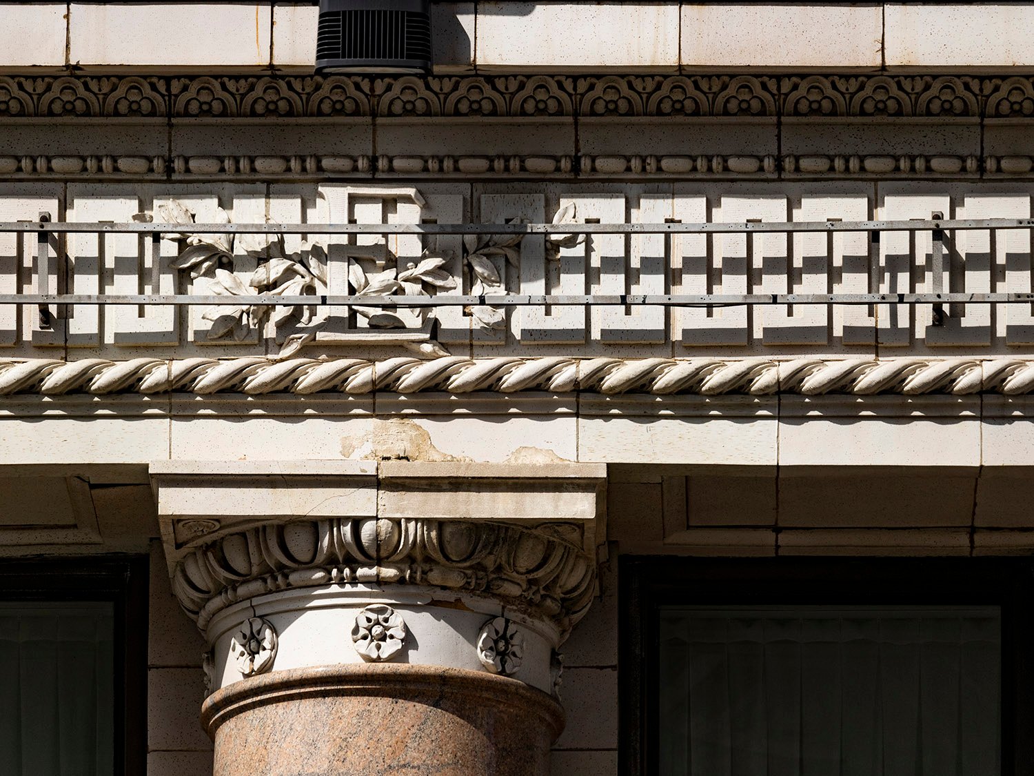 Column capital and terracotta frieze on the facade of the Empire Building, Birmingham, Alabama
