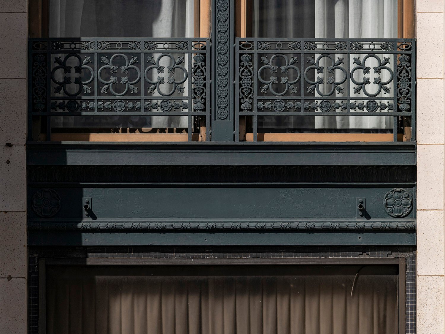 Iron railing and window spandrel on the second floor of the Empire Building, Birmingham. Alabama
