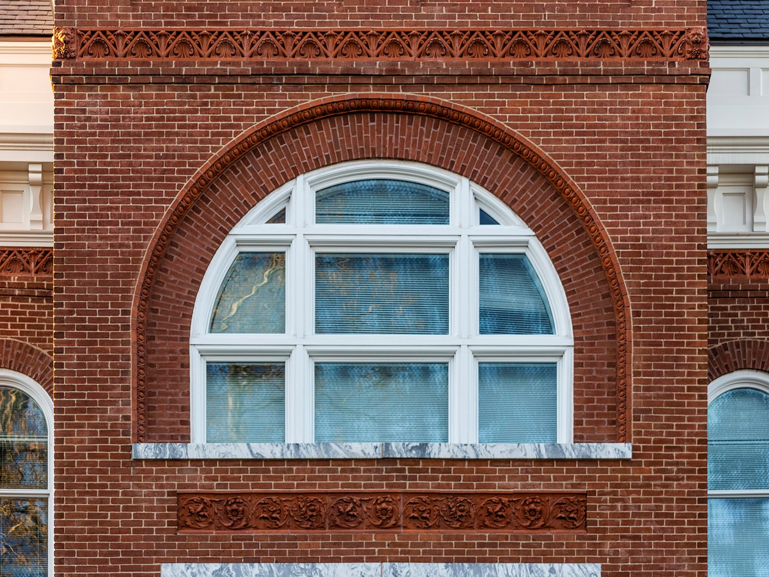 Third-floor window and terracotta trim on the tower of Agnes Scott Hall, Decatur, Georgia