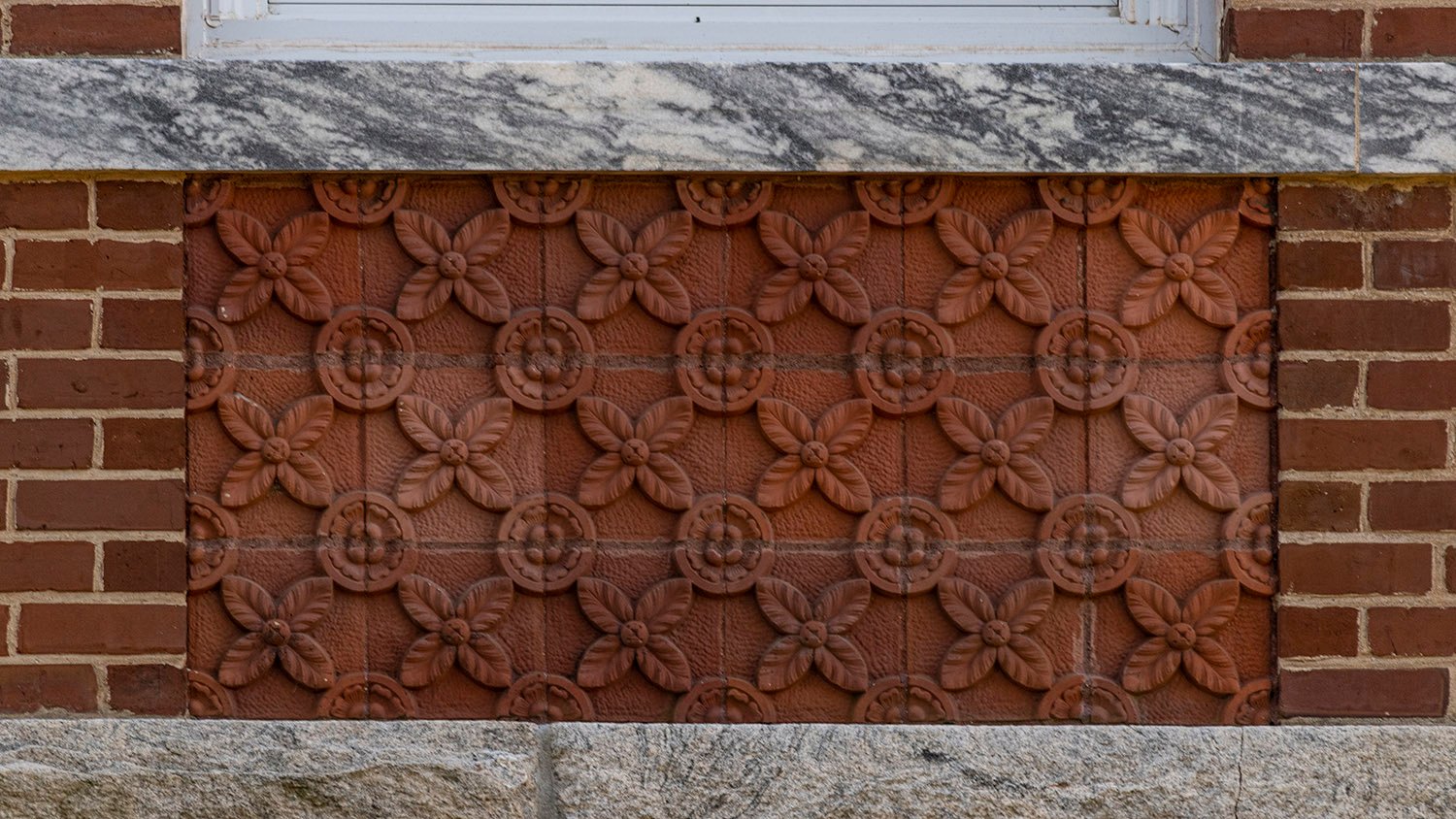 Terracotta spandrel, marble and granite stringcourses on the facade of Agnes Scott Hall, Decatur, Georgia
