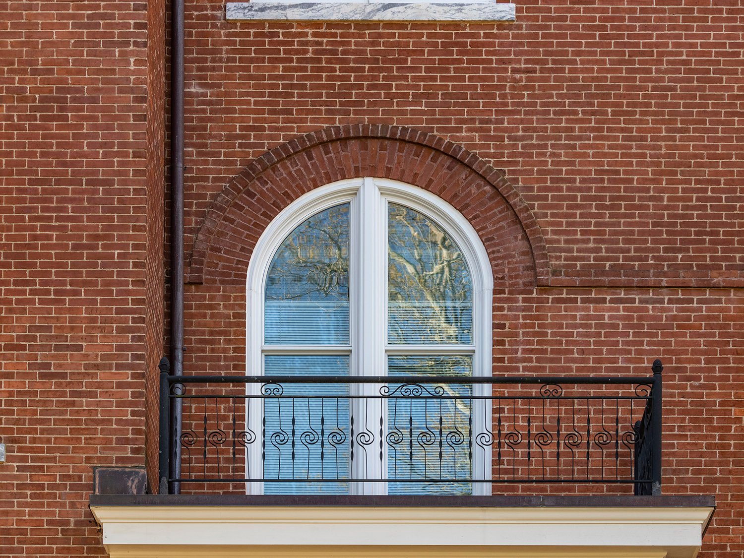 Second-floor window and balcony on the facade of Agnes Scott Hall, Decatur, Georgia
