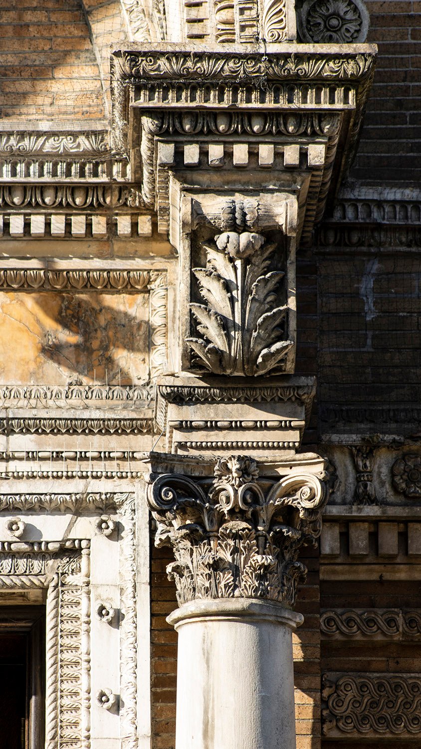 Decorated corbel and Corinthian capital at the main entrance of Judson Memorial Church, New York