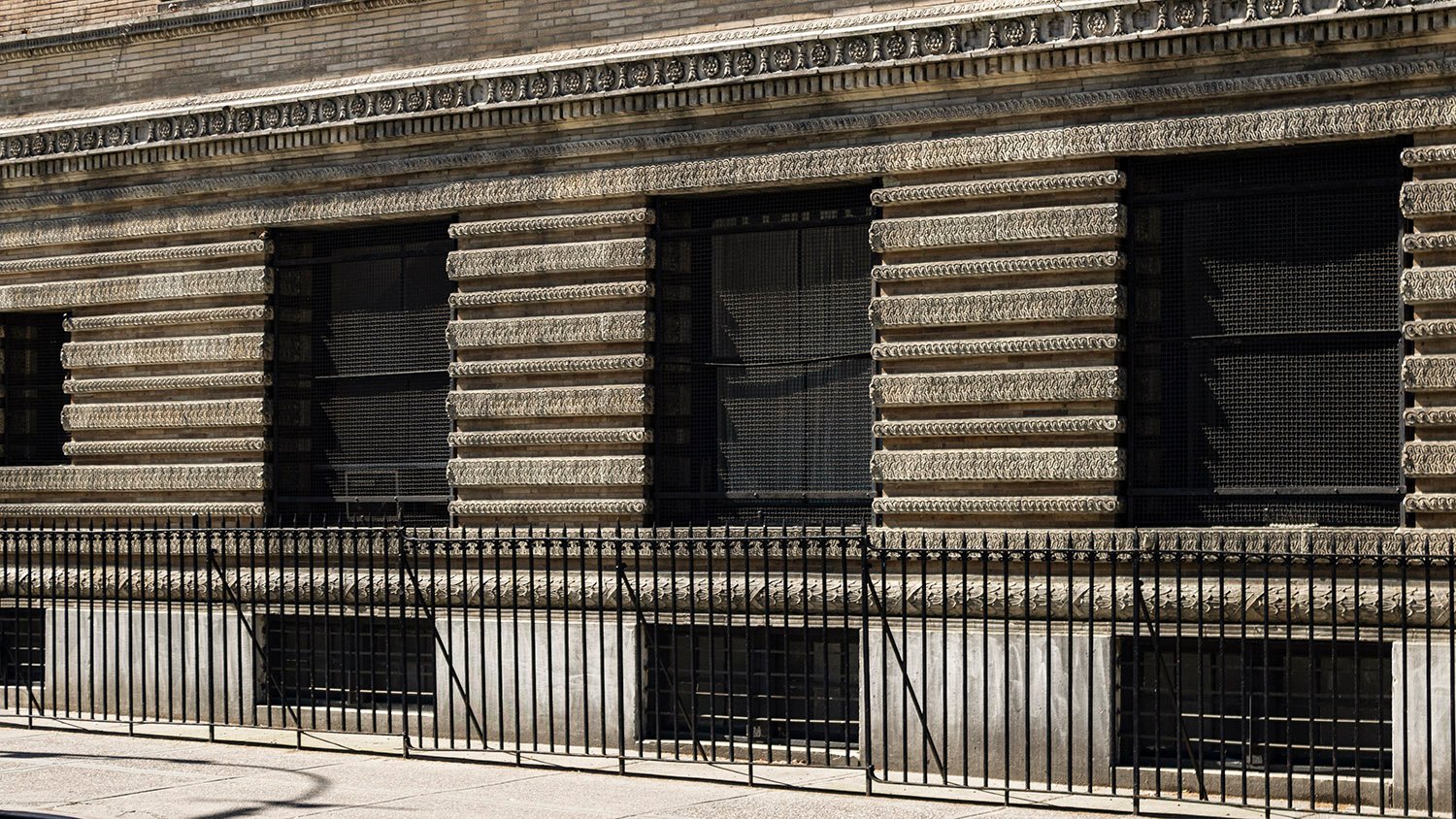 Ground-floor and basement windows on the north facade of Judson Memorial Church, New York