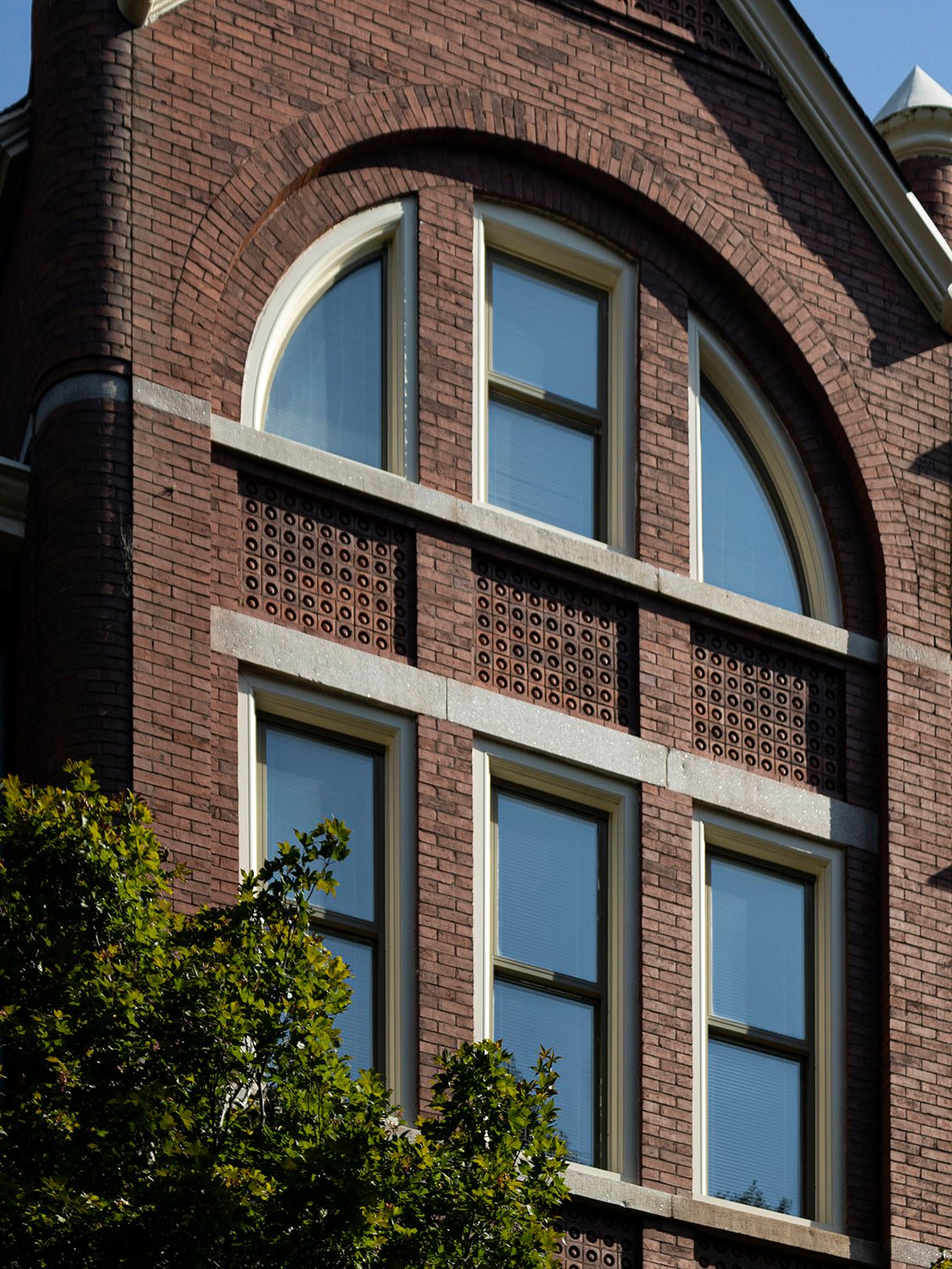 Third- and fourth-floor windows and terracotta spandrels on the southwest corner of the Academic Building at Georgia Tech, Atlanta