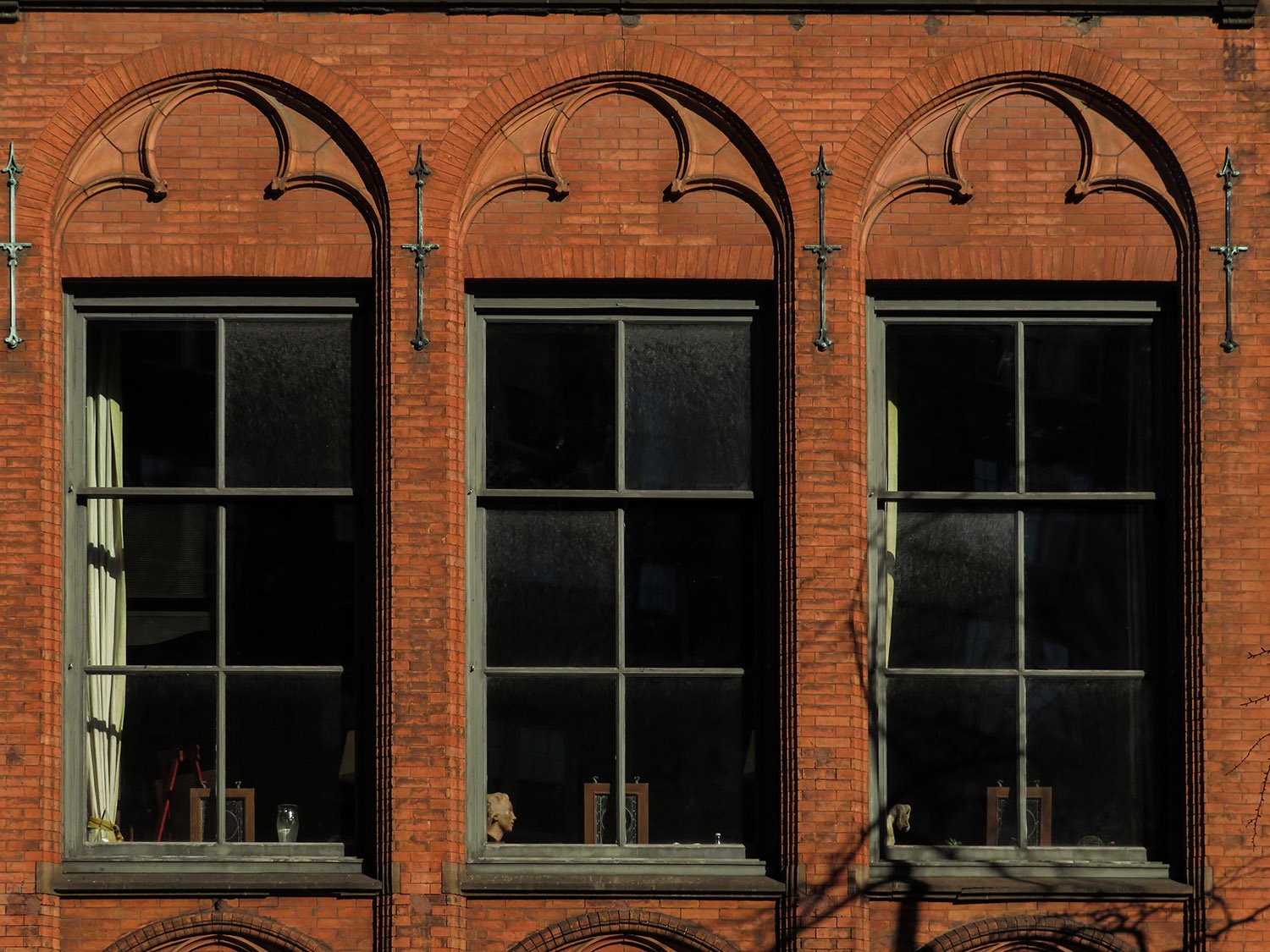 Second-floor windows on the facade of Jackson Square Library, New York
