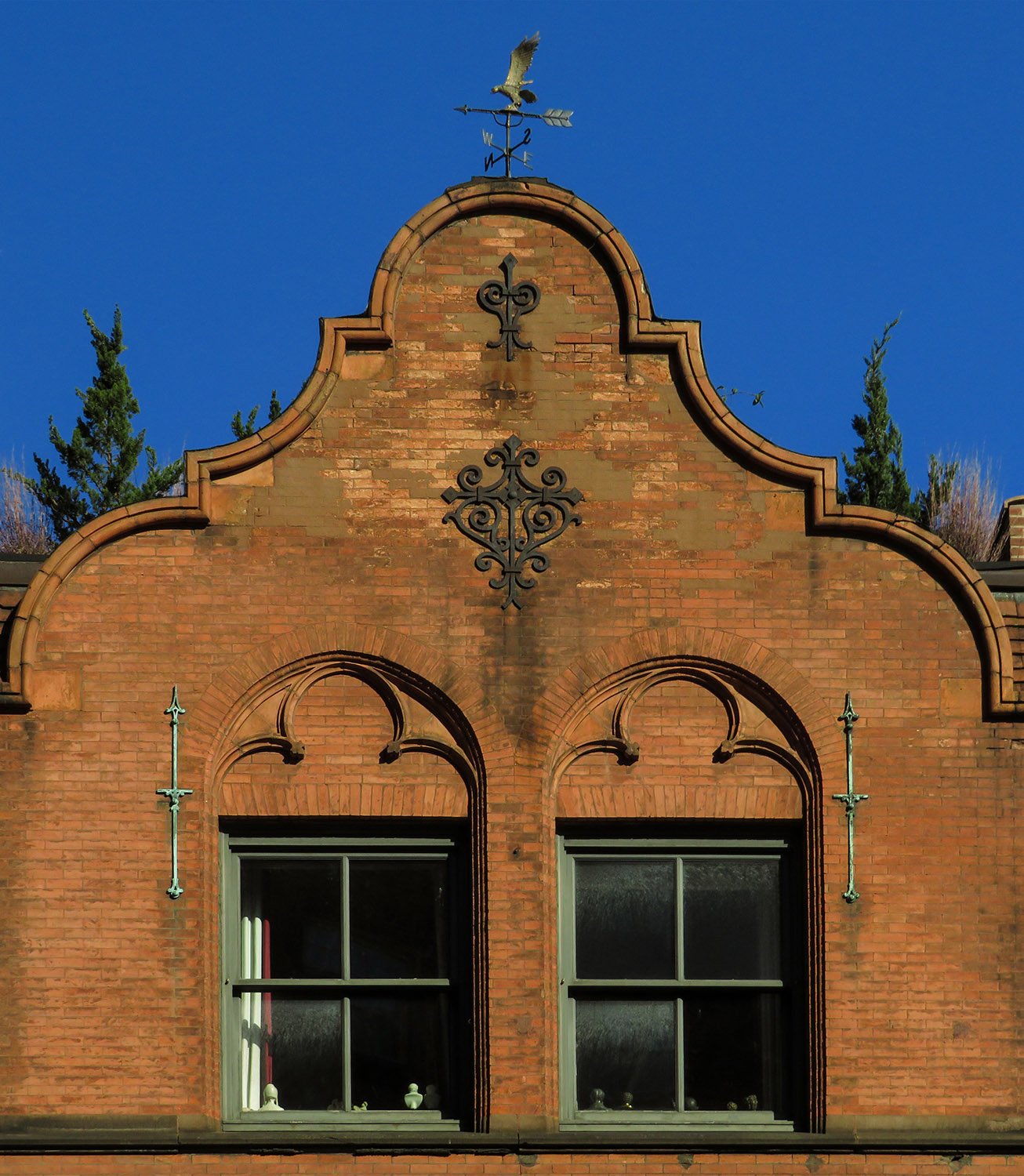 Dutch gable and third-floor windows on the facade of Jackson Square Library, New York