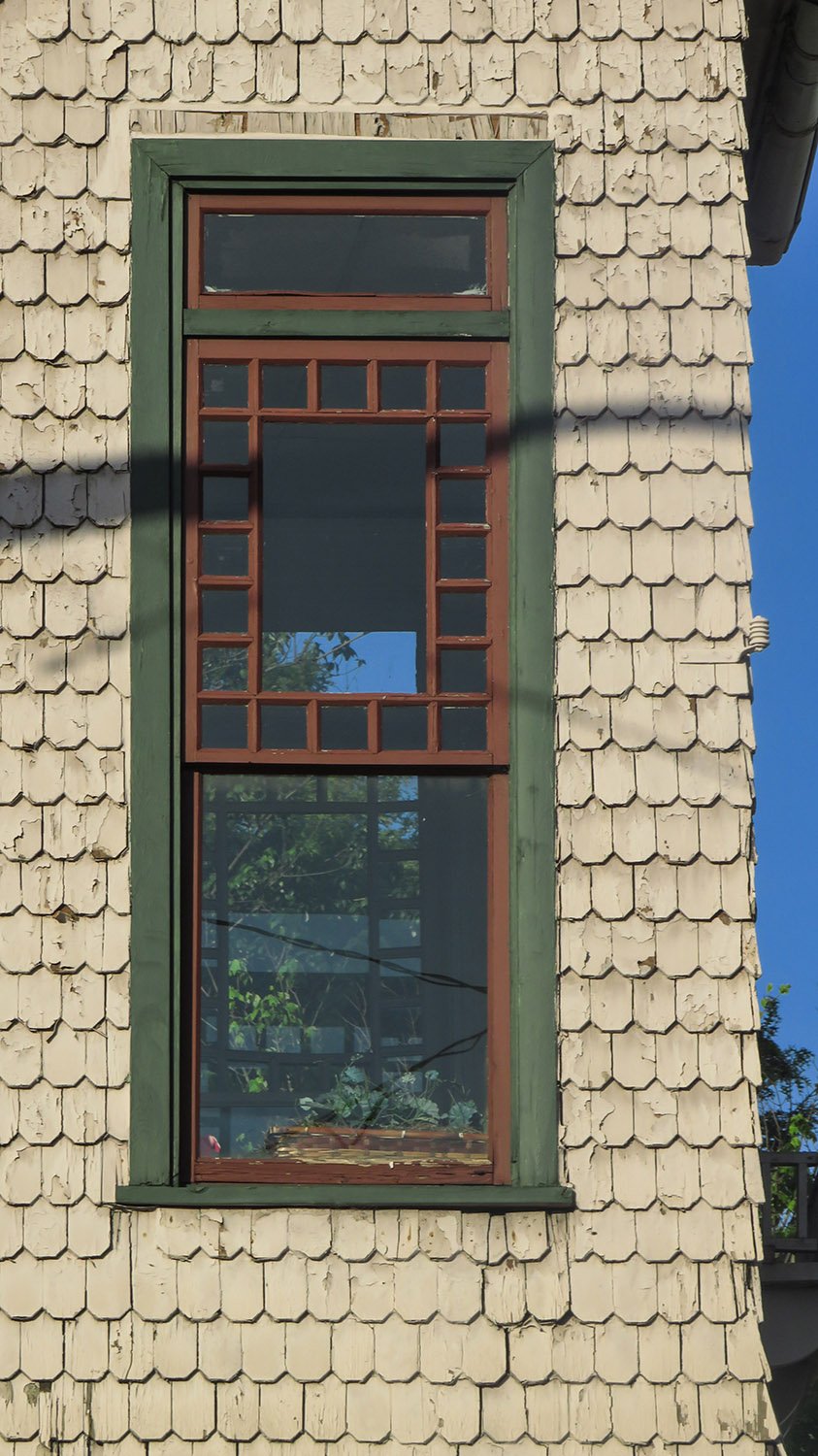 Window and fish-scale shingles on the corner turret of 125 Edgewood Avenue, Atlanta