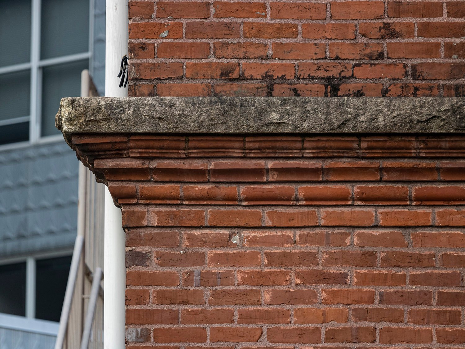 Brick and granite stringcourse on the facade of 125 Edgewood Avenue, Atlanta