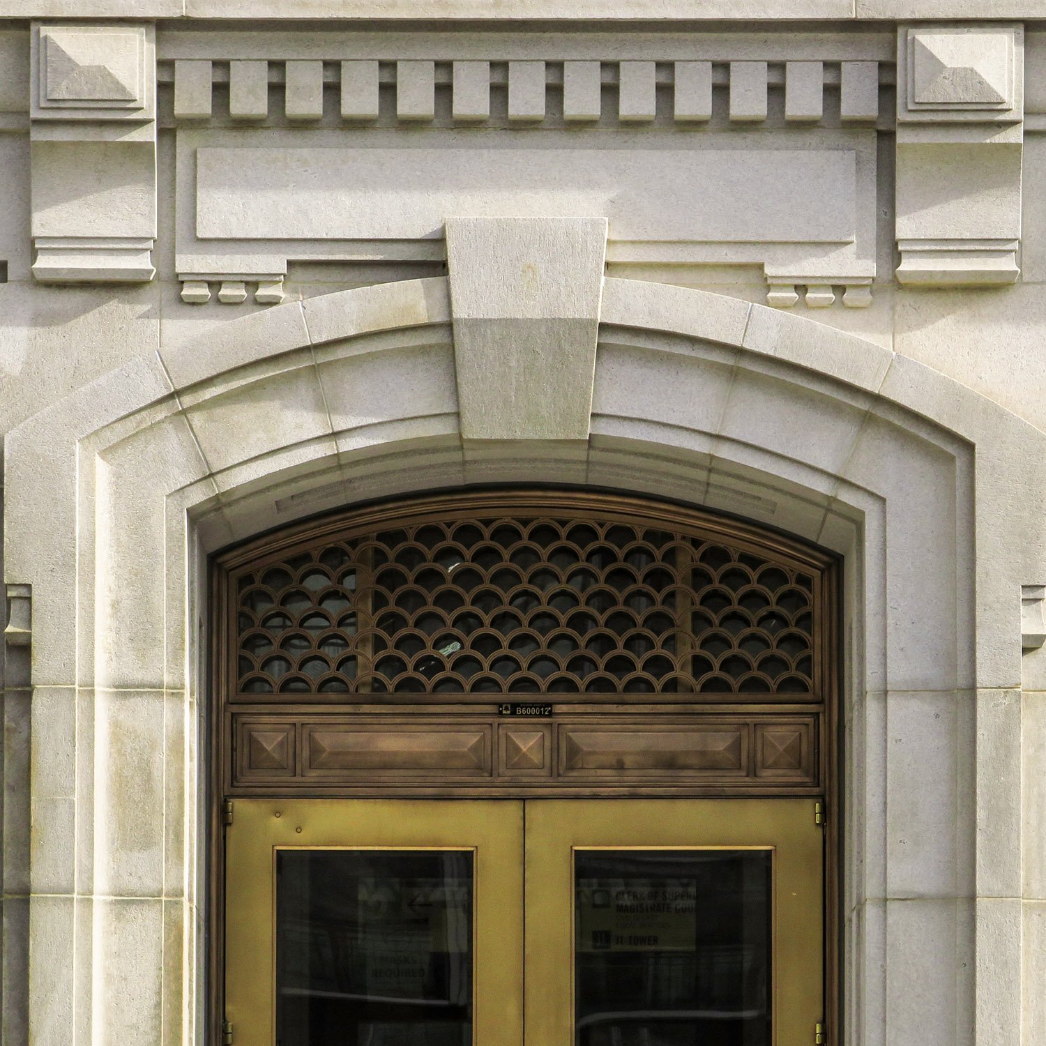 Pediment, keystone, and transom window over a door on the front entrance of the Fulton County Courthouse, Atlanta