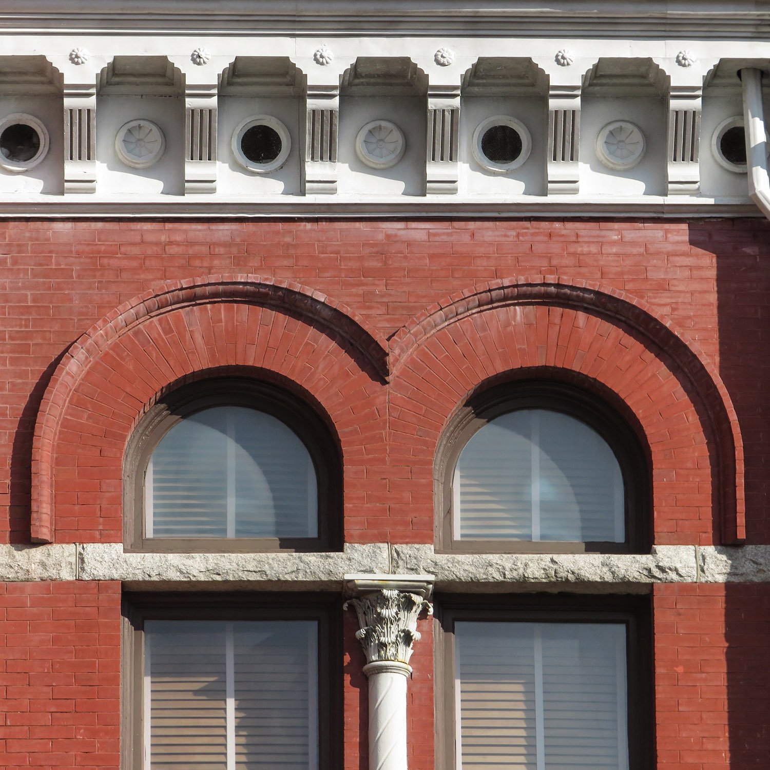 Consoles, frieze, and second-floor windows on the facade of the New Hanover County Courthouse, Wilmington, North Carolina