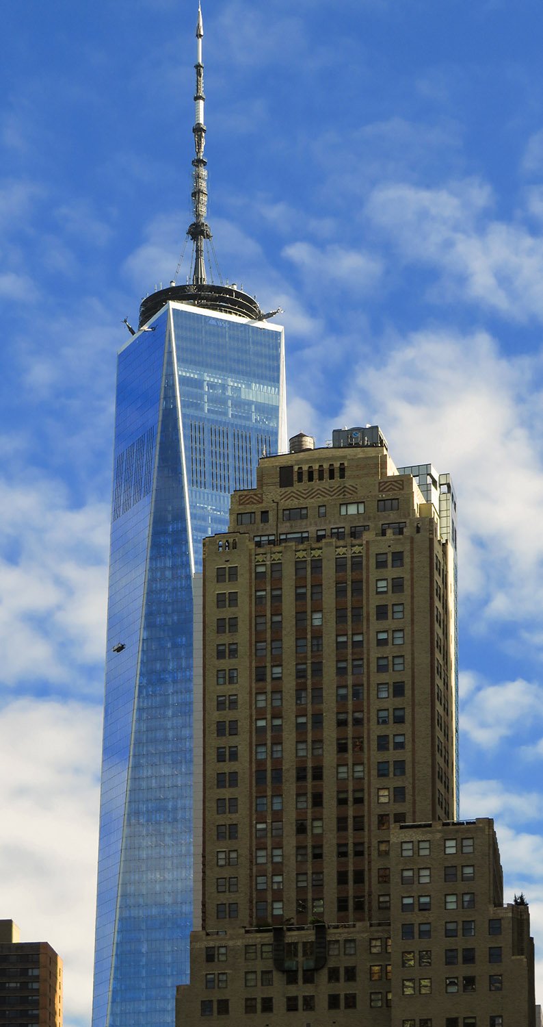 Looking at One World Trade Center from the south, with 19 Rector Street (1930) in the foreground2