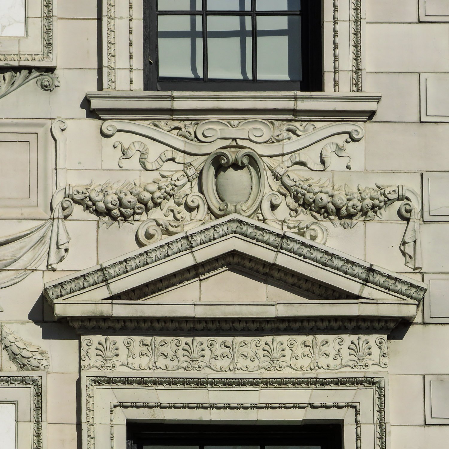 Pediment and ornamentation over a second-floor window on the Robert Wilson Patterson Residence, Washington, D.C. 
