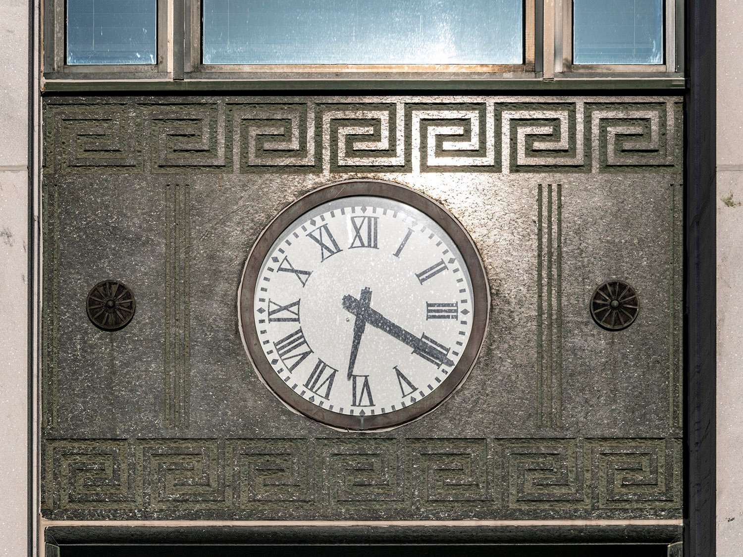 Clock and etched marble spandrel on the facade of the Troup County Courthouse, LaGrange, Georgia