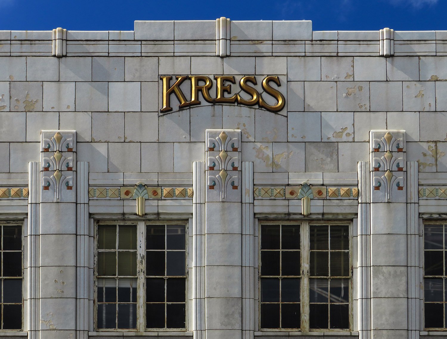 Windows and sign on the facade of S.H. Kress & Co., Anniston, Alabama.