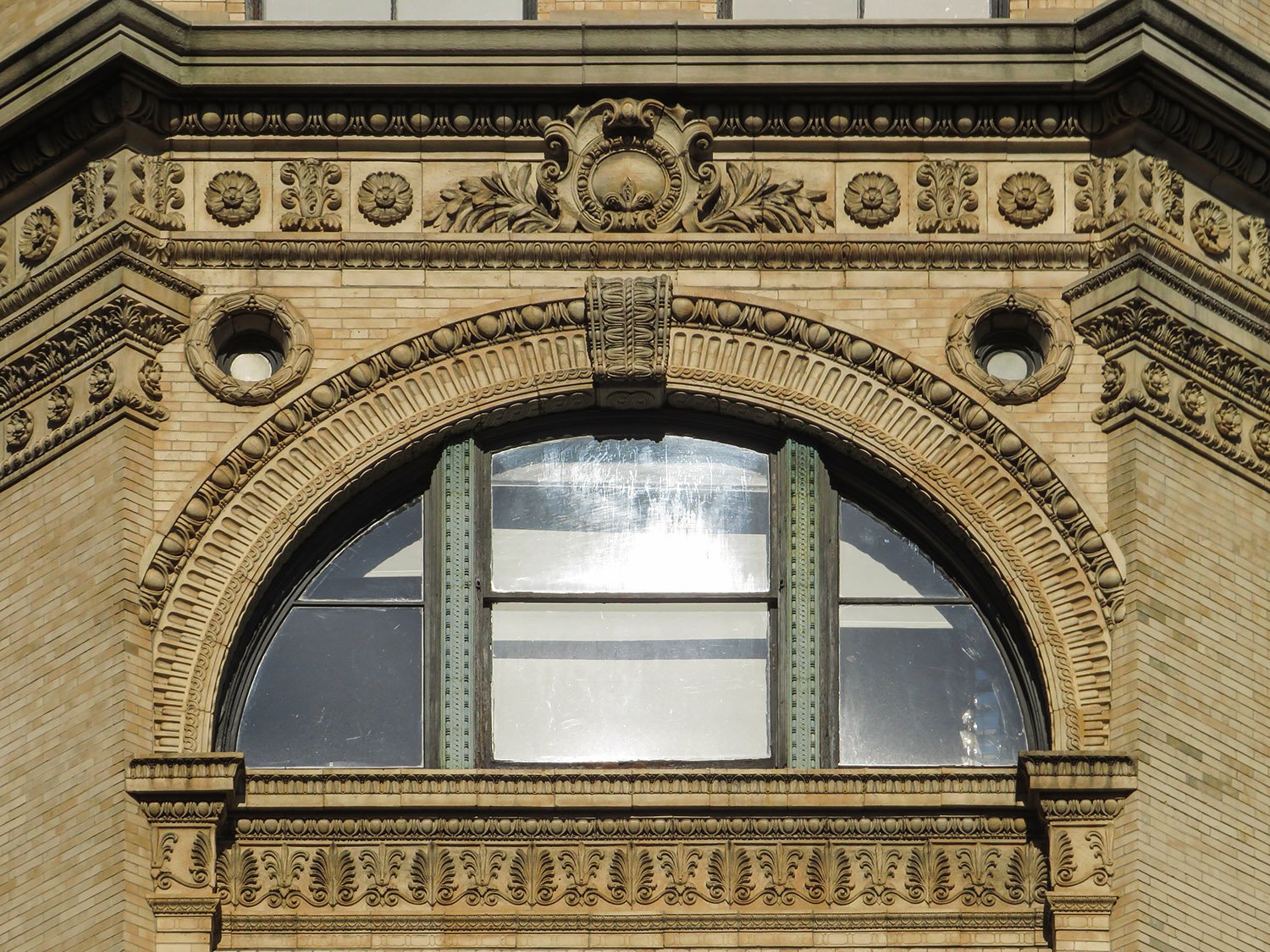 Arched window on the sixth floor of the Cable Building, New York