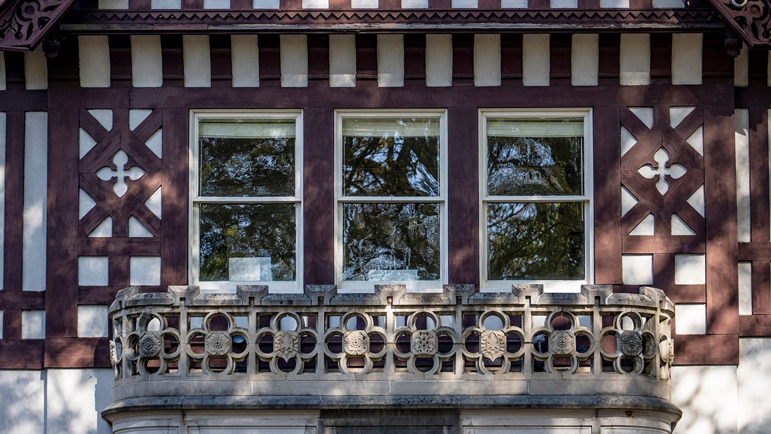 Second-floor windows and balcony on the facade of Callanwolde, Atlanta