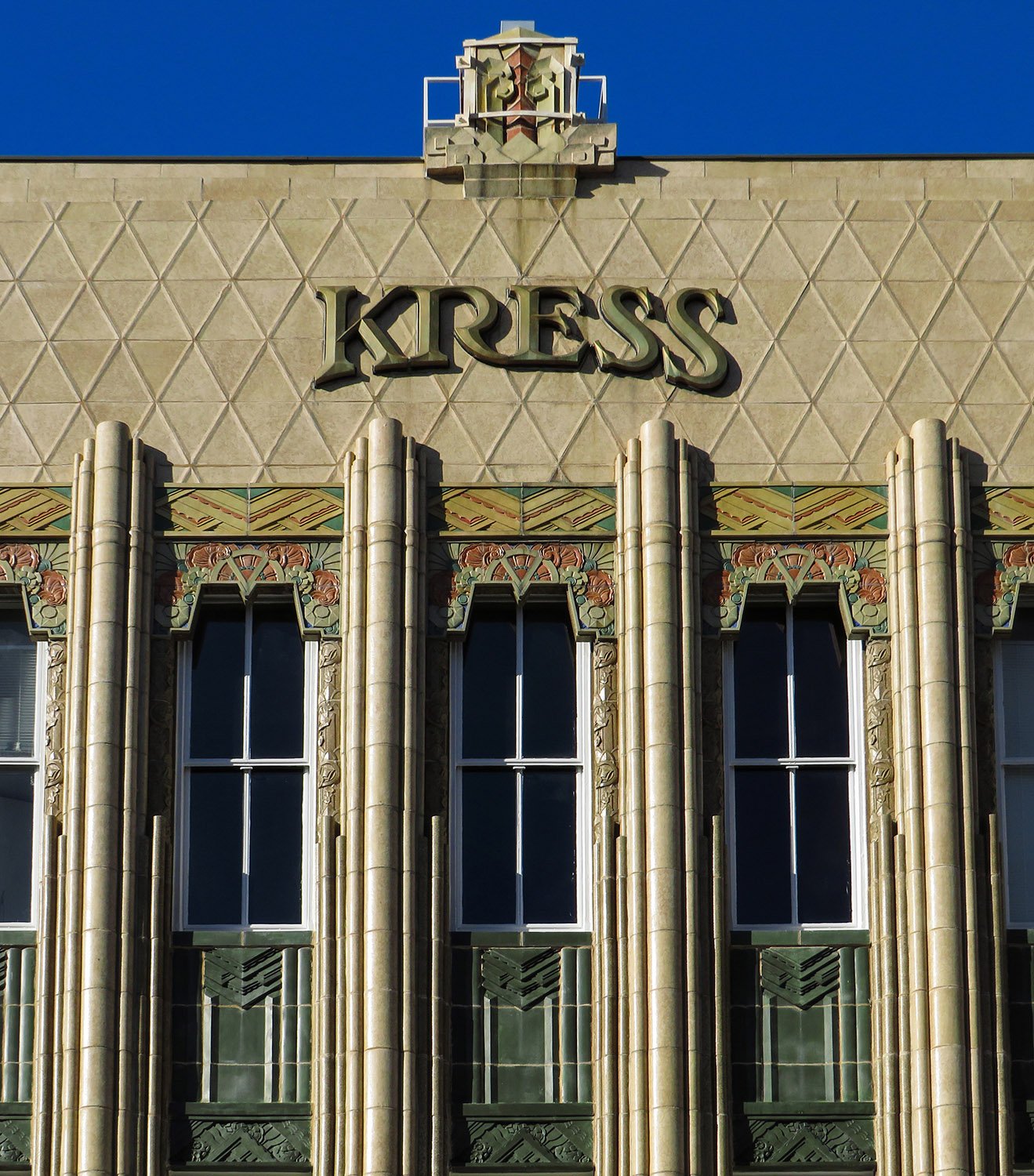 Third-floor windows on the facade of S.H. Kress & Co., Charleston, South Carolina