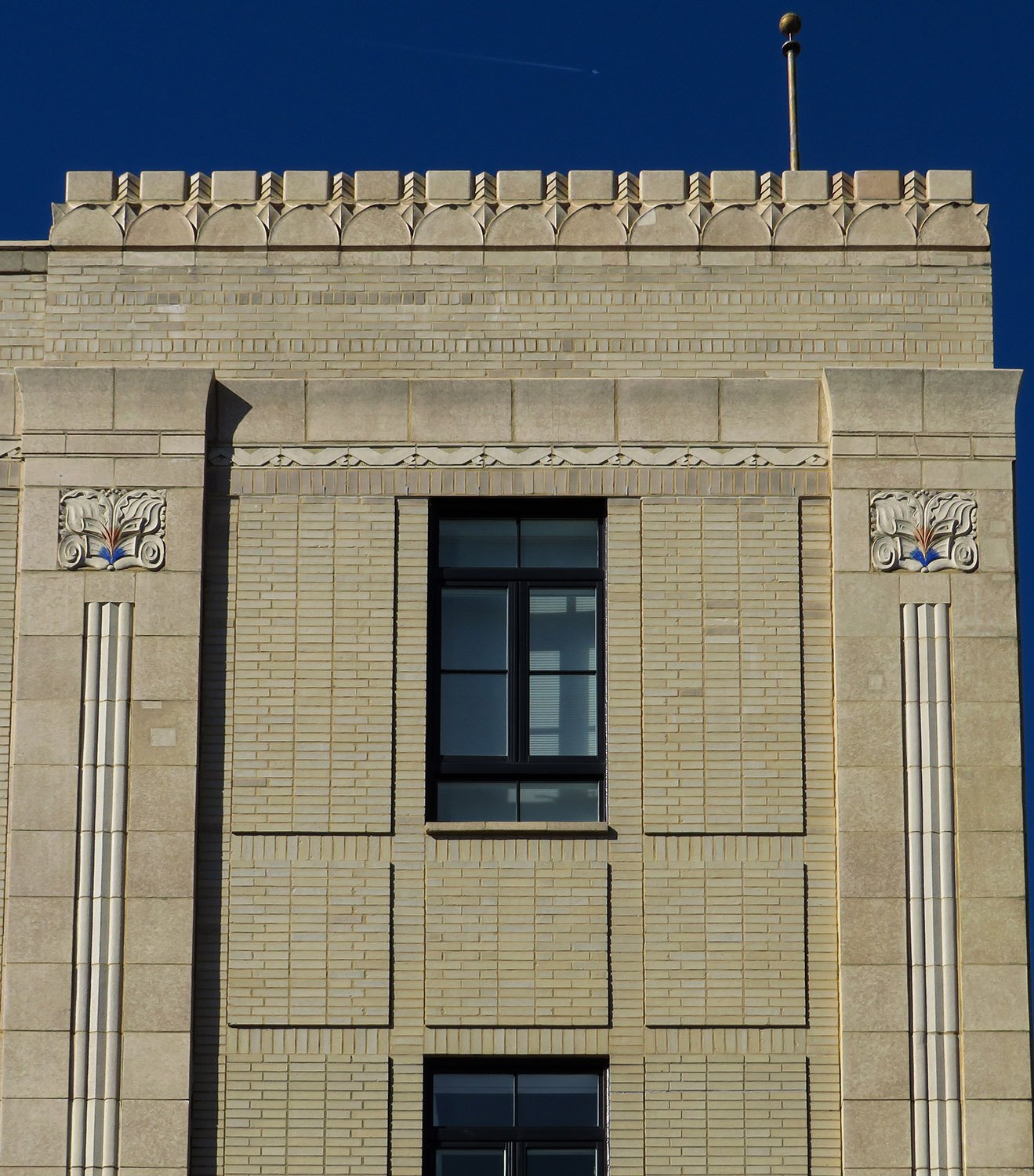 Fourth-floor window on the east facade of S.H. Kress & Co., Durham, North Carolina