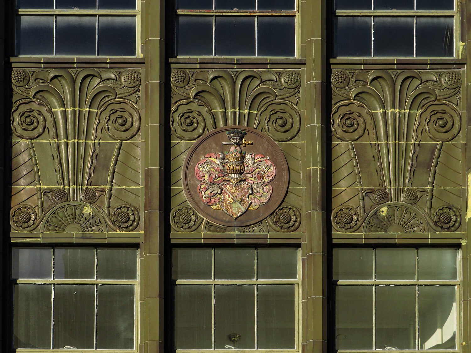 Decorated spandrels between the second and third-floor windows on the facade of S.H. Kress & Co., Greensboro, North Carolina
