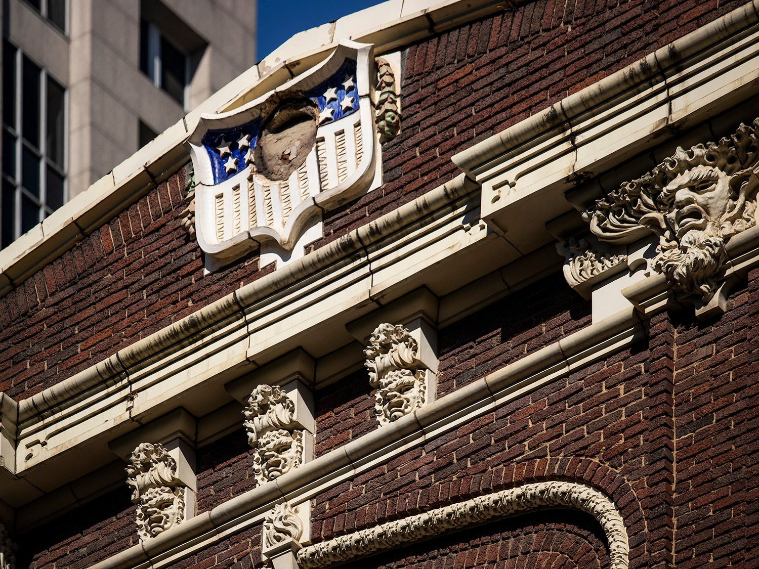 Cornice, pediment, and terracotta ornamentation on the facade of Atlanta Lodge