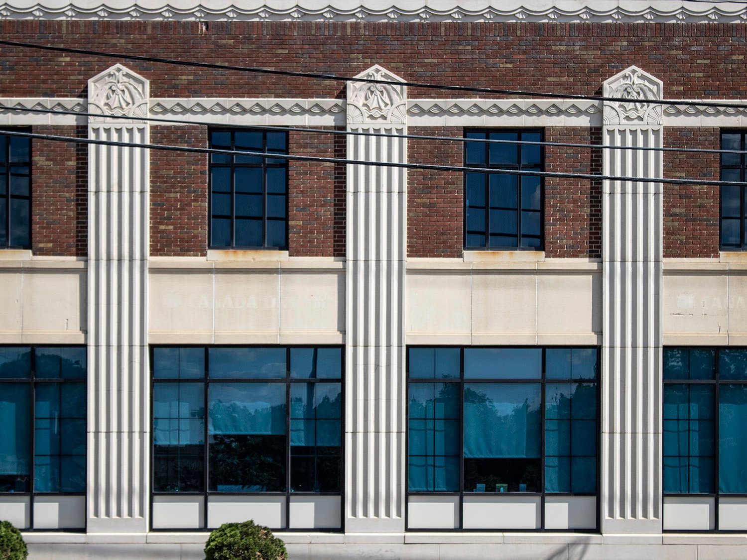 Windows and pilasters on the facade of the Greensboro Coca-Cola Bottling Company, Greensboro, North Carolina