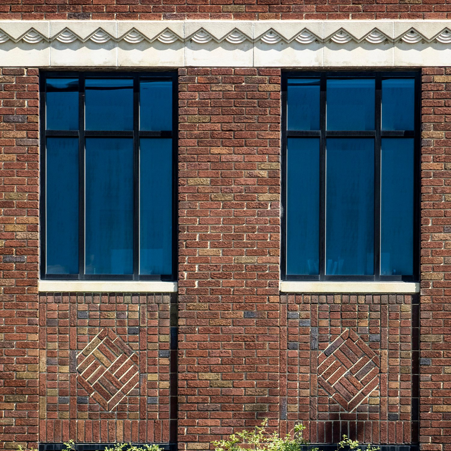 Windows and brick spandrels on the facade of the Greensboro Coca-Cola Bottling Company, Greensboro, North Carolina