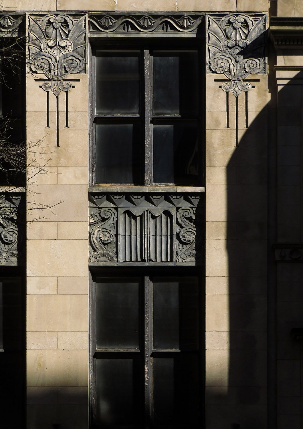 Windows, spandrels, and ornamentation on the facade of Regenstein's