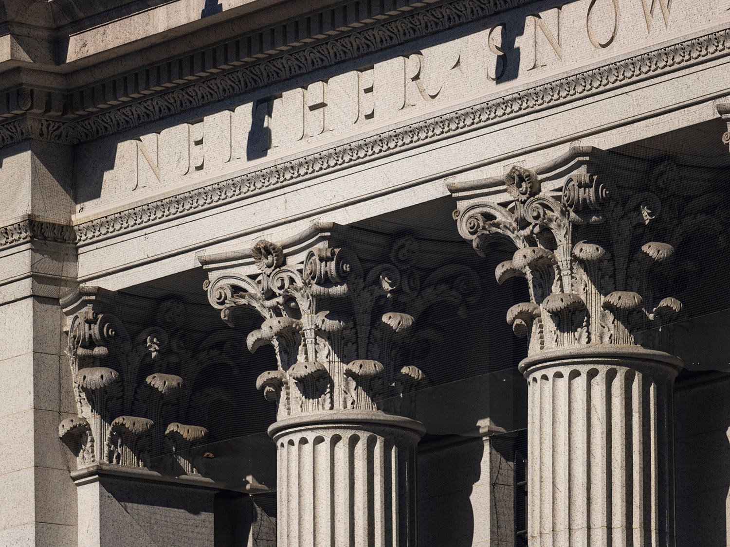 Inscription and Corinthian capitals on the facade of the United States Post Office, New York