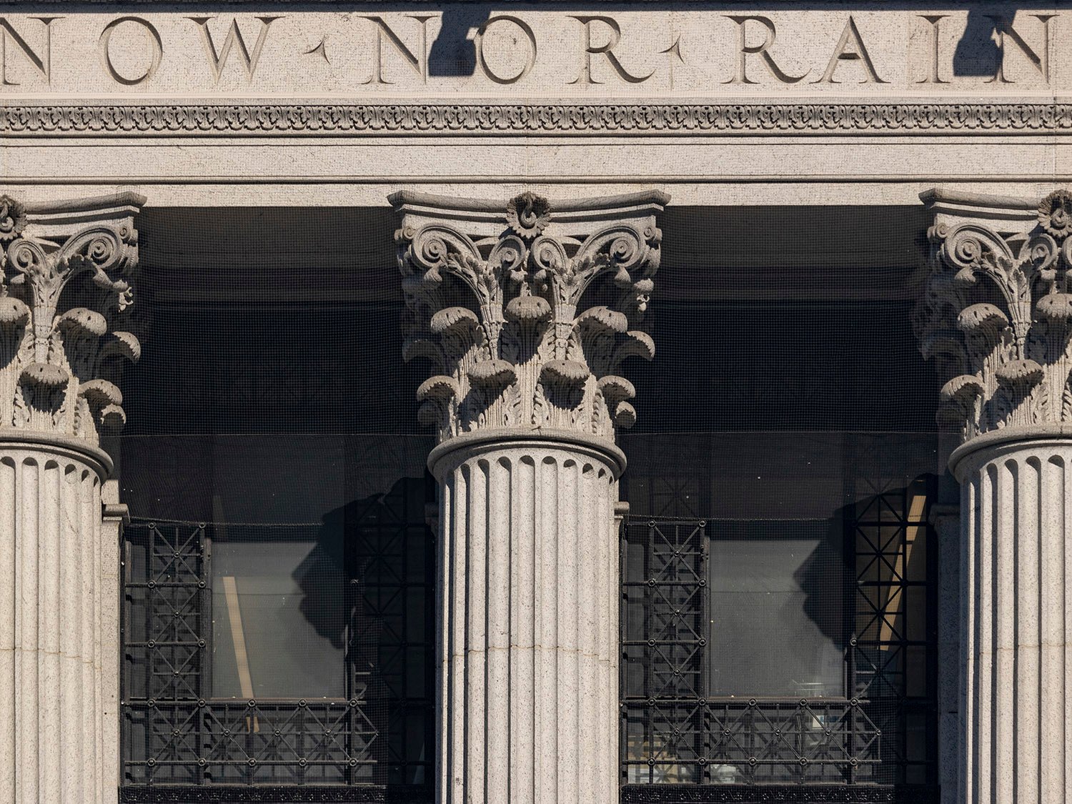 Inscription and Corinthian capitals on the facade of the United States Post Office, New York