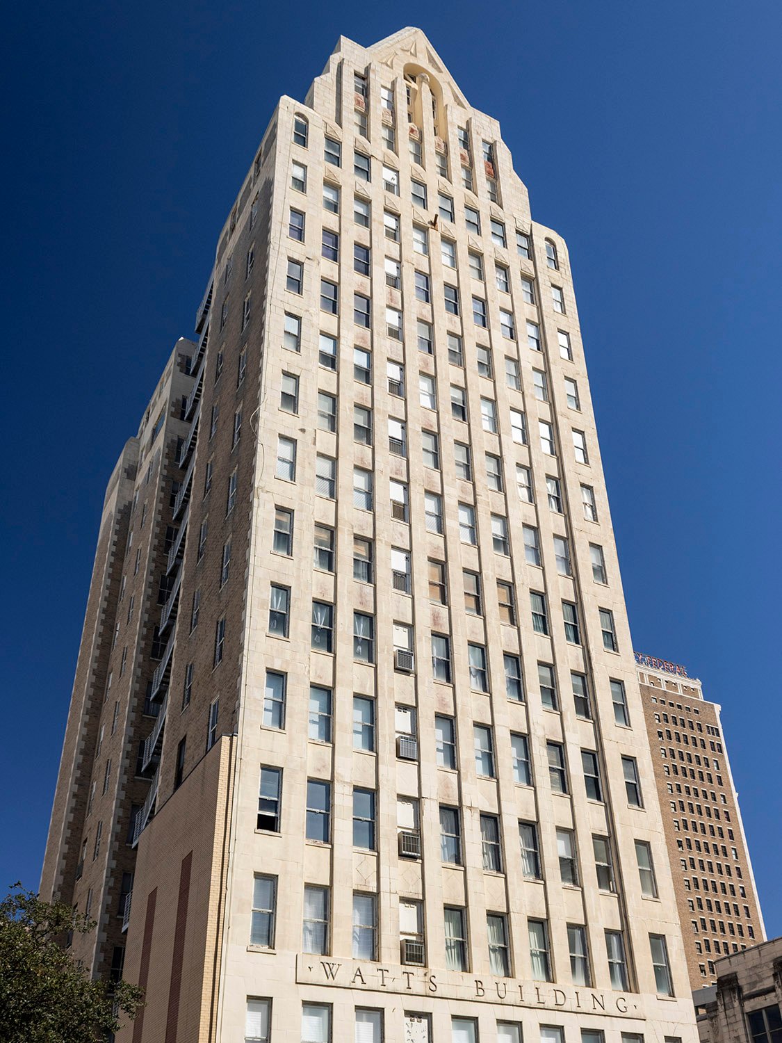 Looking up at the Watts Building from the northwest