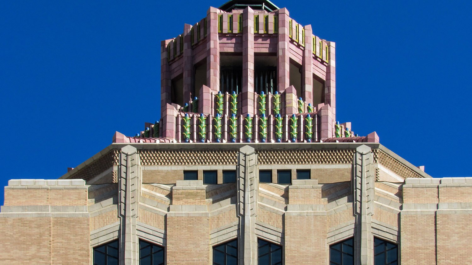 Sixth-floor windows, pinnacles, cornice, marble ornamentation, and tower on the City Building, Asheville, North Carolina