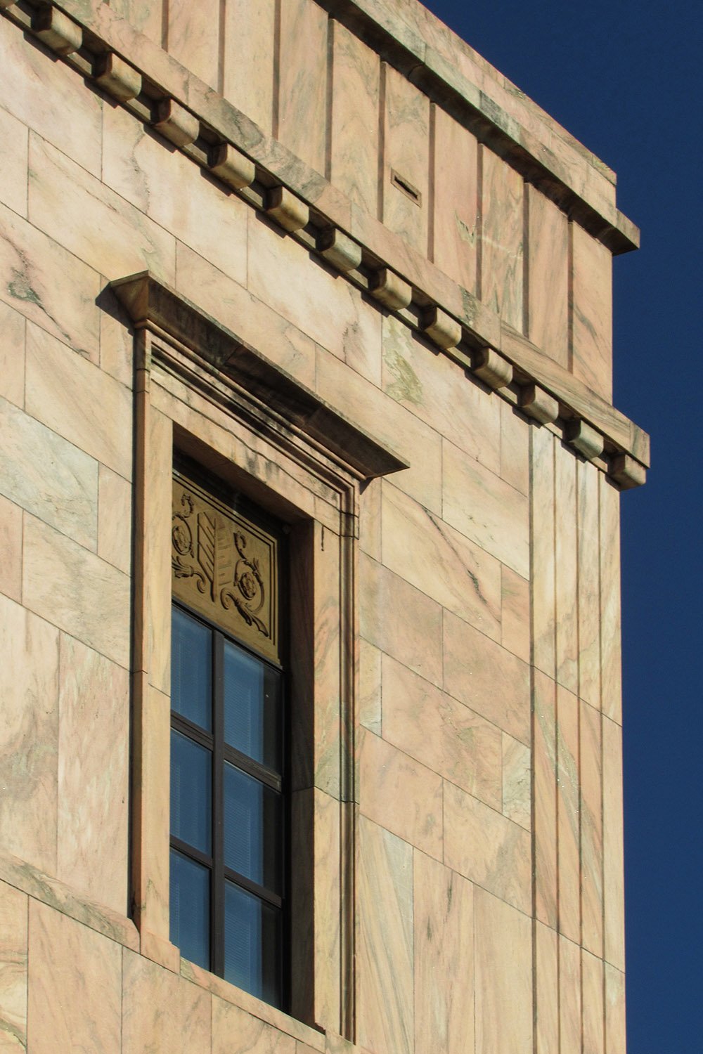 Cornice and first-floor window on the south elevation of the City Building, Asheville, North Carolina