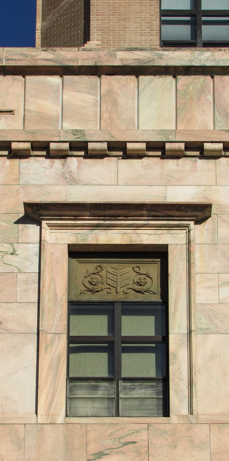 Cornice and first-floor window on the facade of the City Building, Asheville, North Carolina