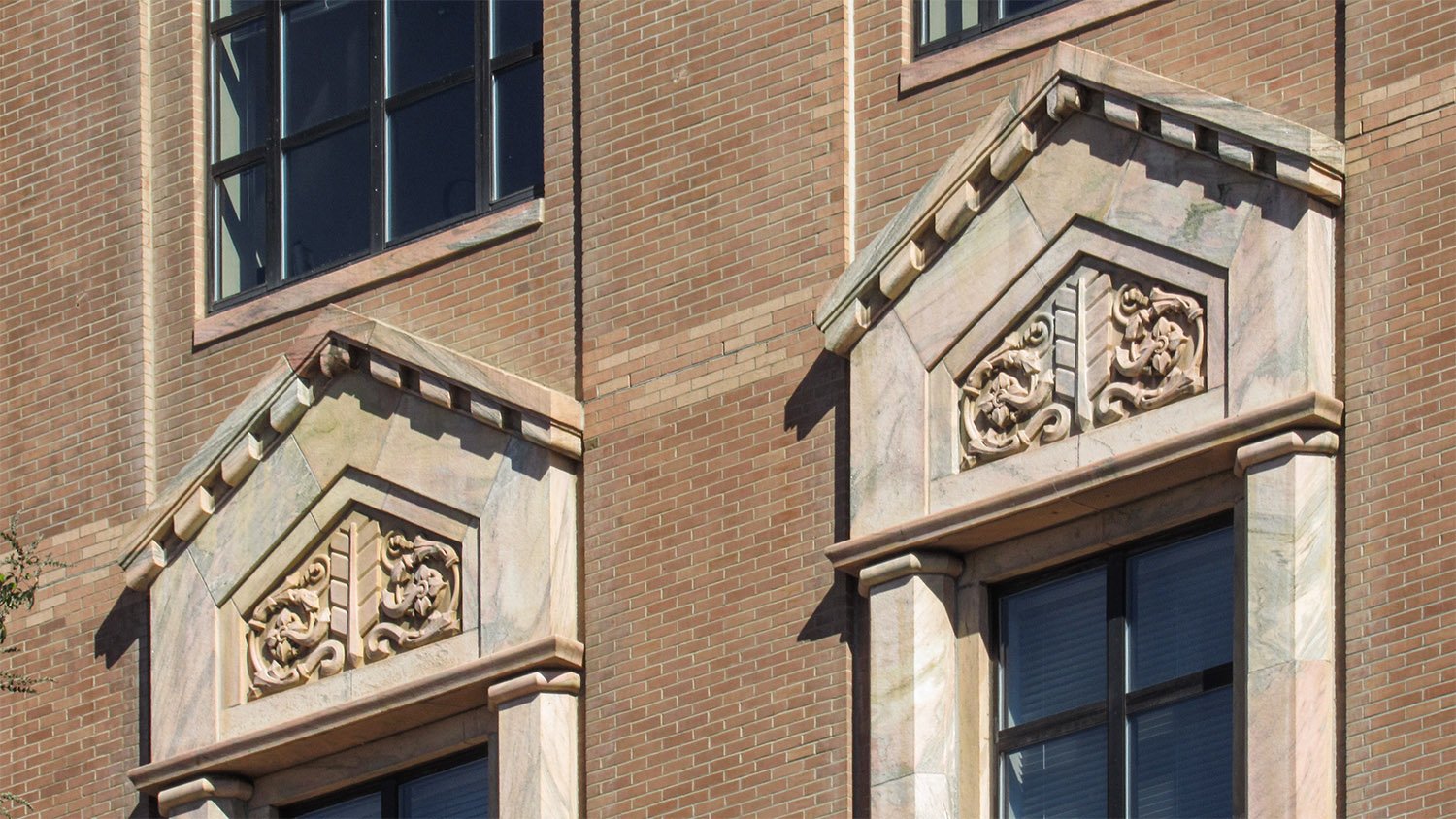 Second-floor windows on the facade of the City Building, Asheville, North Carolina