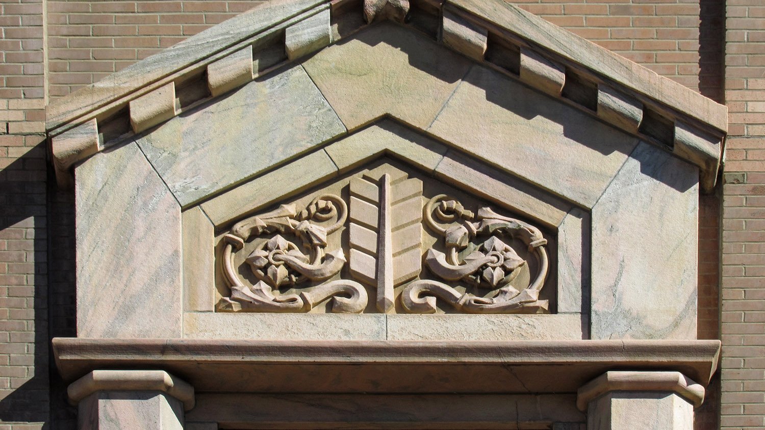 Marble pediment over a second-floor window of the City Building, Asheville, North Carolina
