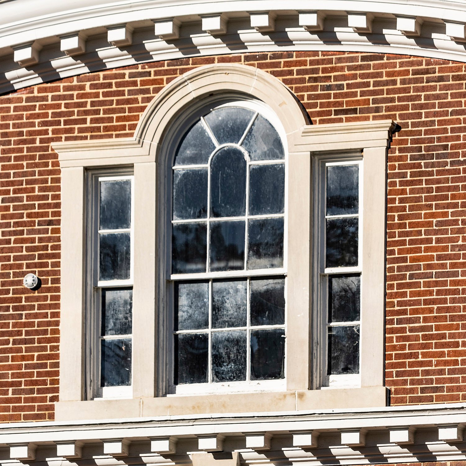 Dentilled cornice and Palladian window on the facade of North Fulton High School, Atlanta
